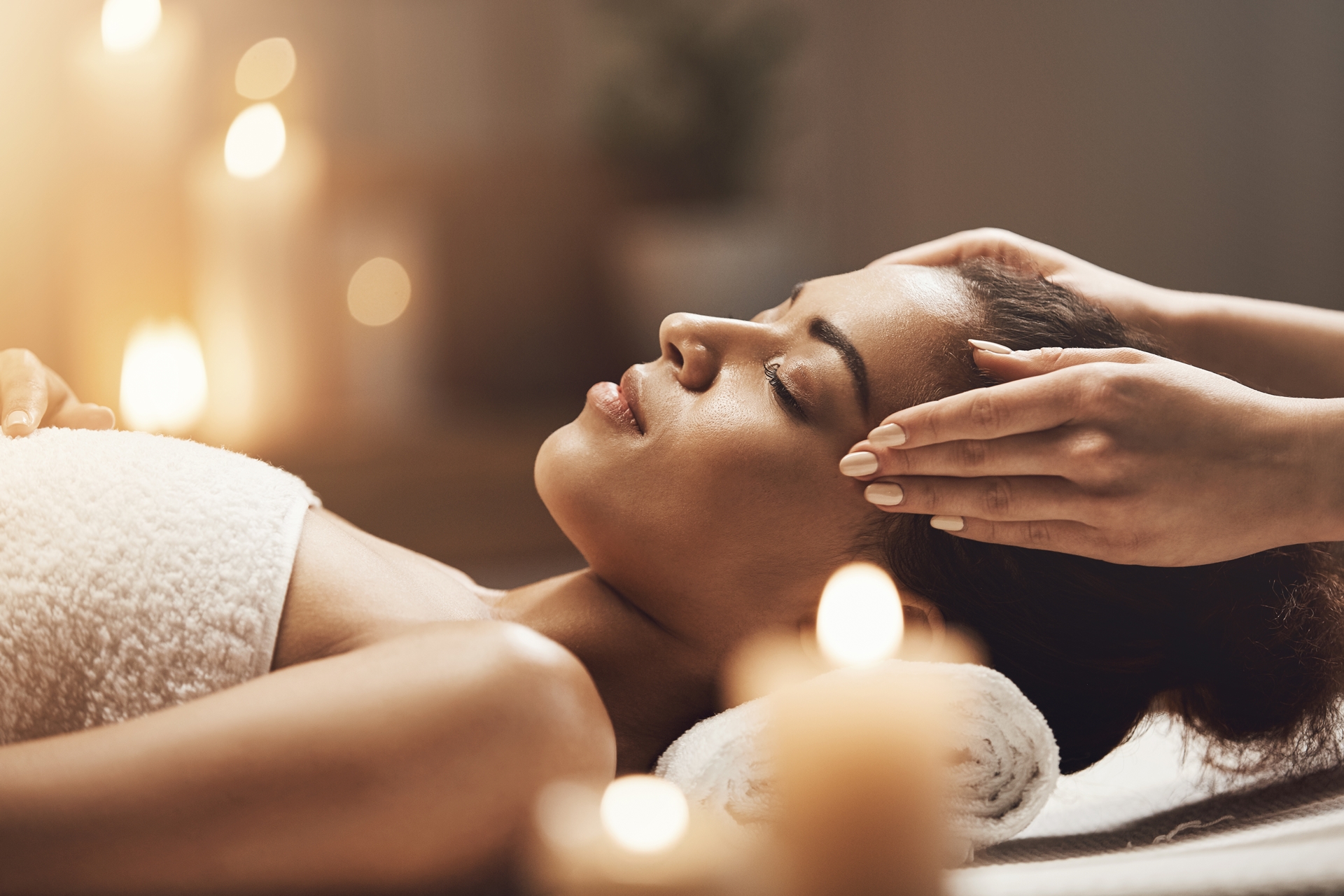 Wellness-Massage_attractive-african-woman-enjoying-face-massage-in-spa-salon